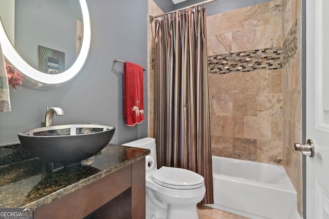 full bathroom featuring toilet, vanity, and shower / tub combo with curtain