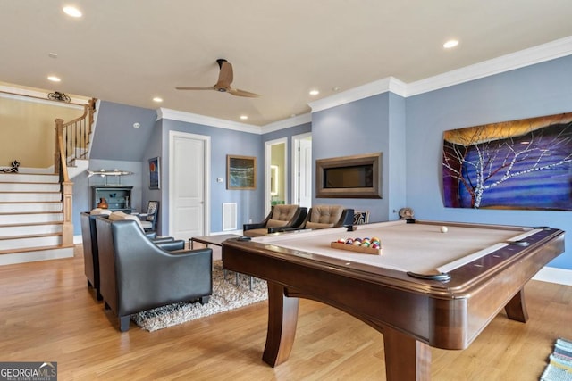 playroom with light hardwood / wood-style floors, ceiling fan, crown molding, and pool table