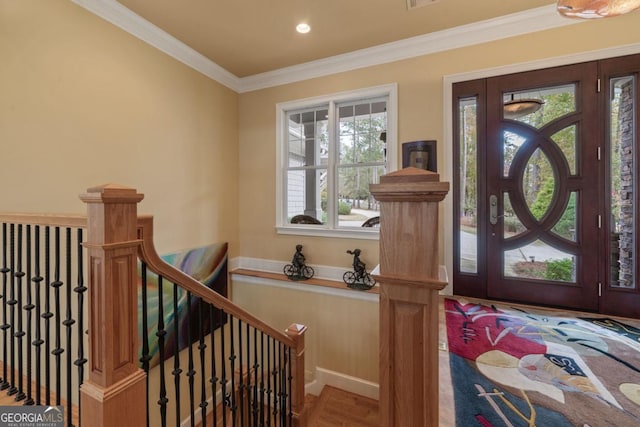 entrance foyer featuring hardwood / wood-style floors and crown molding