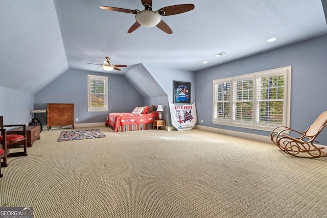 bedroom with carpet floors, multiple windows, and ceiling fan