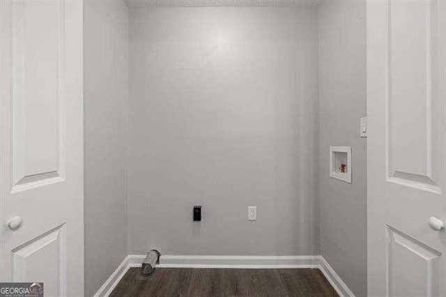 clothes washing area featuring electric dryer hookup, hookup for a washing machine, dark wood-type flooring, and a textured ceiling