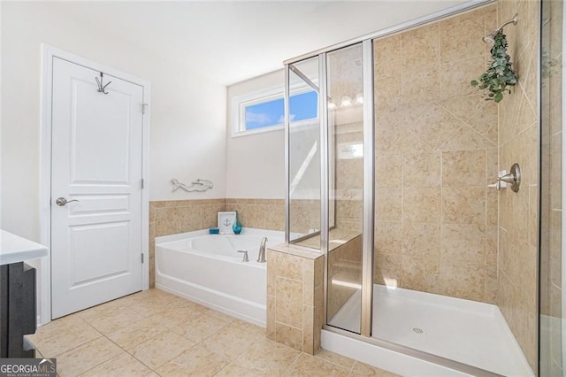 bathroom with tile patterned floors and independent shower and bath