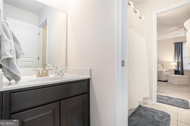 bathroom with tile patterned floors and vanity