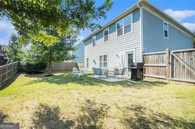 rear view of property with a patio area and a yard