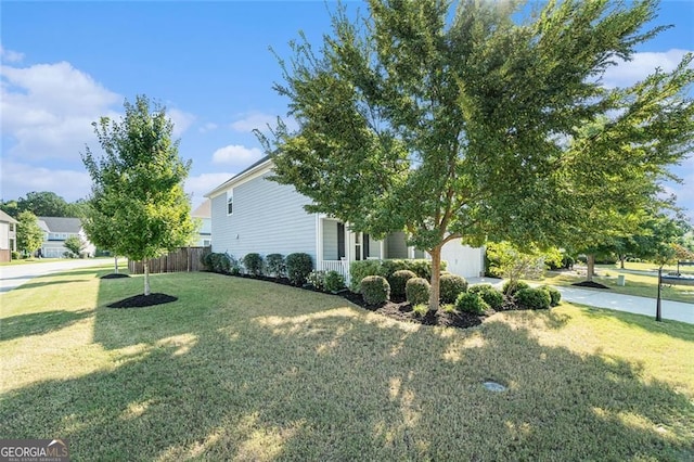 view of side of home with a lawn