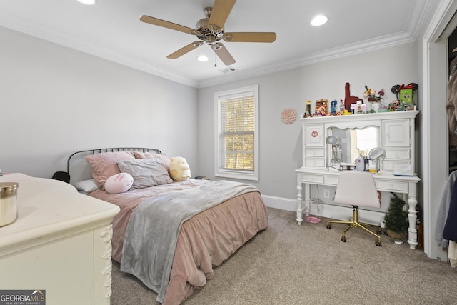 carpeted bedroom with ceiling fan and ornamental molding