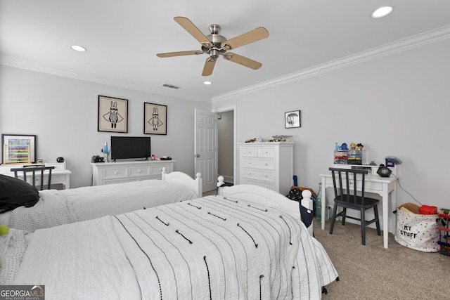 carpeted bedroom with ceiling fan and ornamental molding