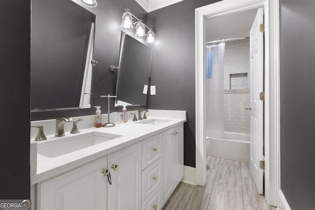 bathroom featuring shower / tub combo and vanity