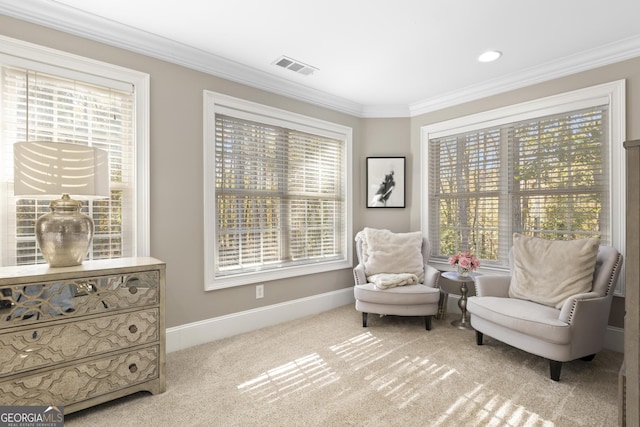 living area with carpet floors and crown molding