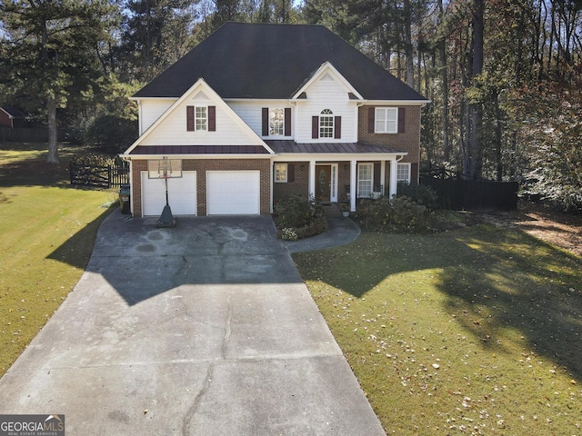 view of front property featuring a porch, a garage, and a front lawn