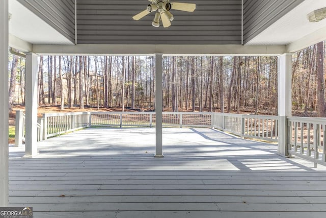 wooden terrace featuring ceiling fan