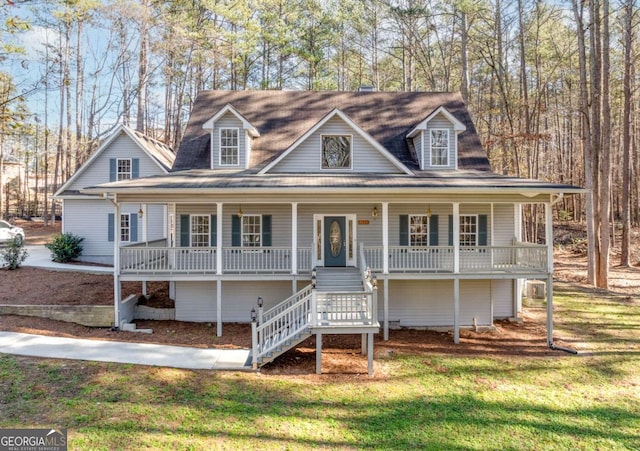 view of front of house featuring covered porch and a front lawn