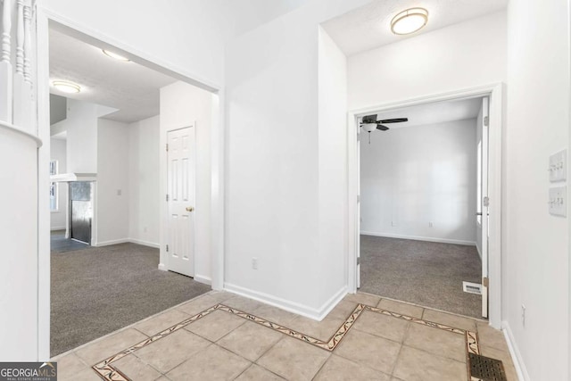 bathroom featuring tile patterned flooring and ceiling fan