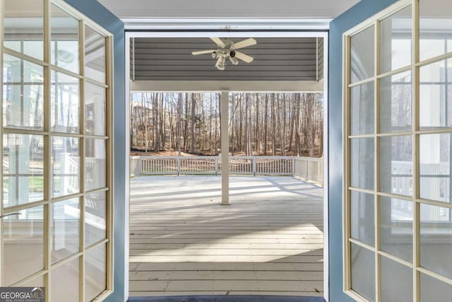 doorway to outside featuring ceiling fan