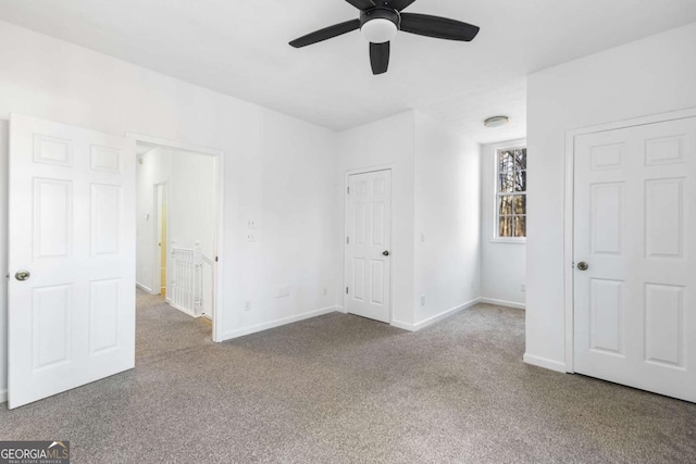 unfurnished bedroom with carpet and ceiling fan