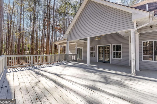 wooden terrace featuring ceiling fan