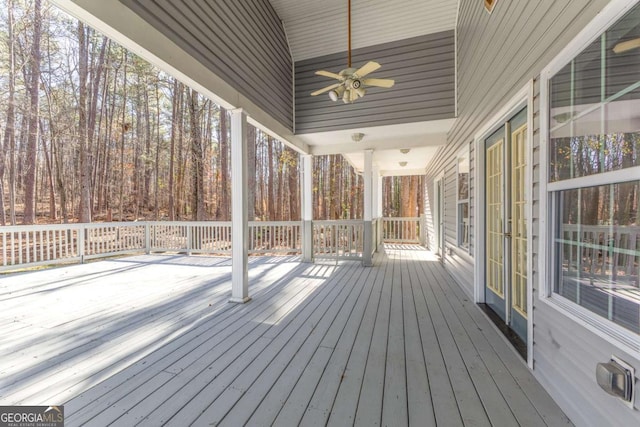 wooden terrace featuring ceiling fan