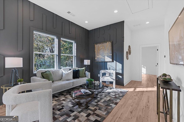 living room with light hardwood / wood-style flooring