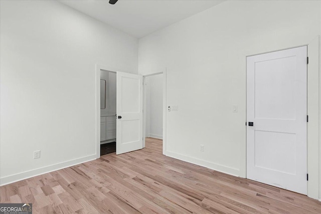 unfurnished bedroom with ceiling fan and light hardwood / wood-style floors