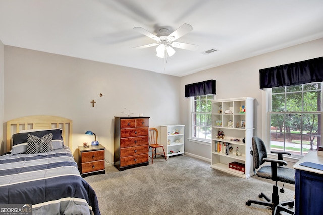 carpeted bedroom with ceiling fan