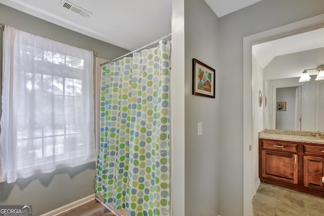 bathroom with curtained shower