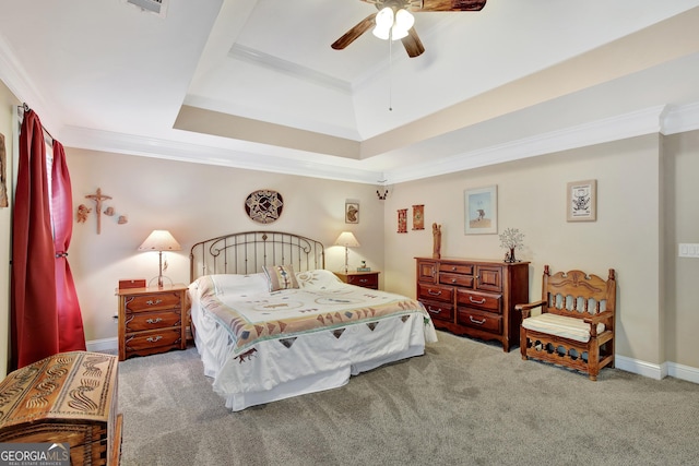 carpeted bedroom featuring a raised ceiling, crown molding, and ceiling fan