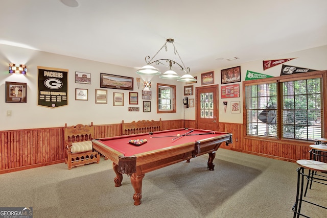 playroom with pool table, wood walls, and carpet