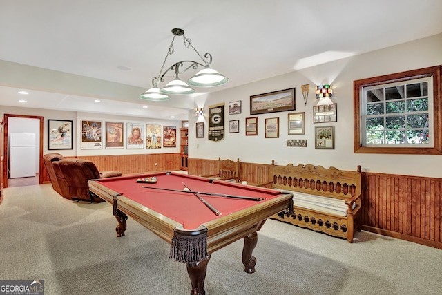 recreation room with pool table, wooden walls, and carpet floors