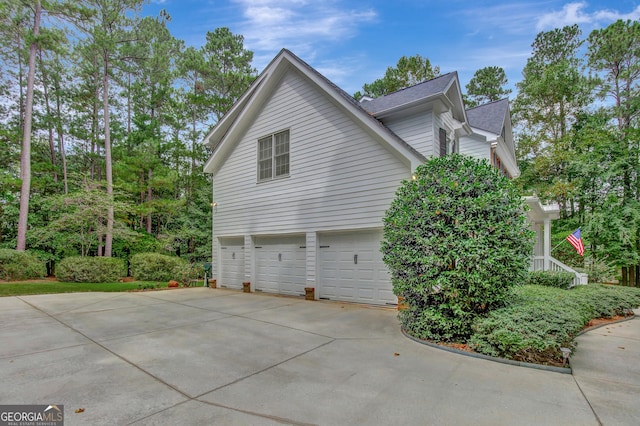 view of side of home with a garage