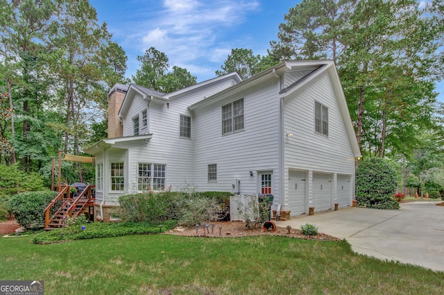 exterior space featuring a garage and a front yard