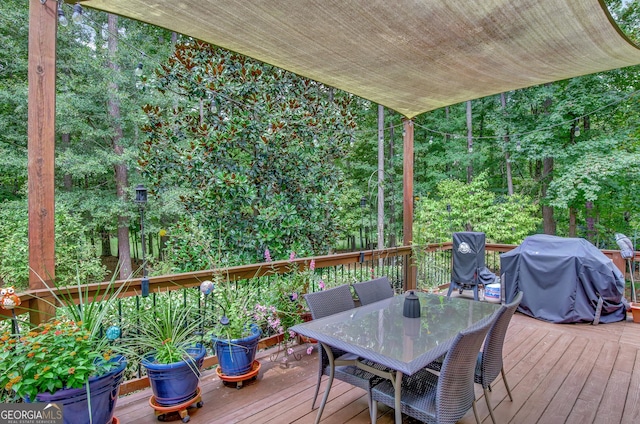 wooden terrace featuring area for grilling