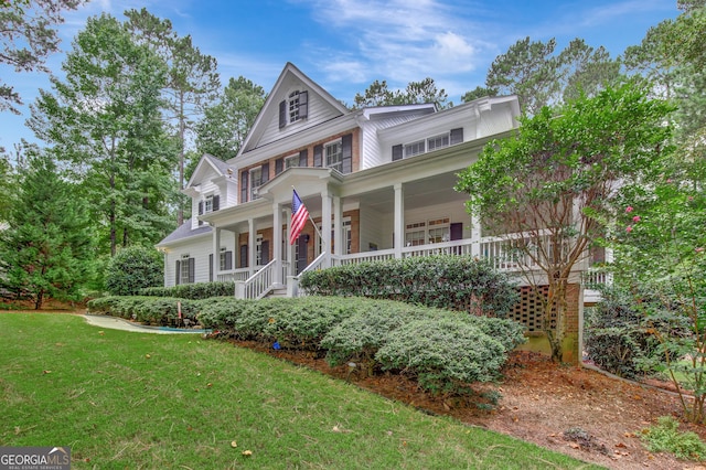 victorian home featuring a front yard and covered porch