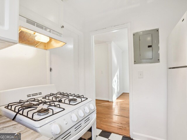 320 3rd St NE Unit 1, Atlanta, GA 30308 - kitchen with white appliances, electric panel, and under cabinet range hood