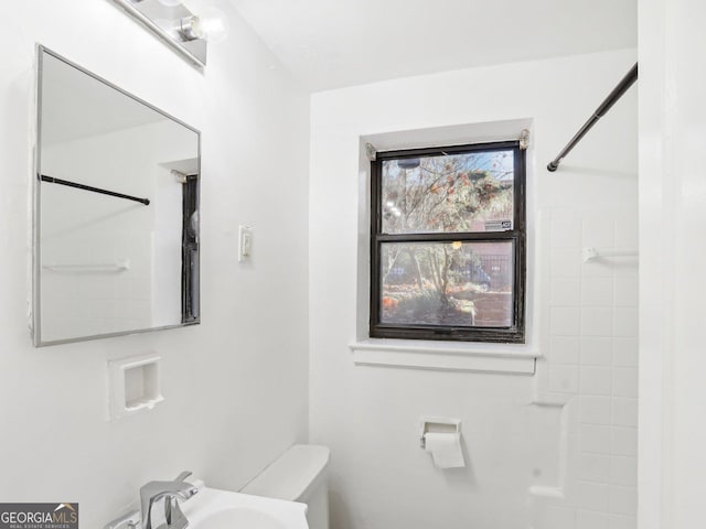 320 3rd St NE Unit 1, Atlanta, GA 30308 - bathroom featuring toilet, a sink, and walk in shower