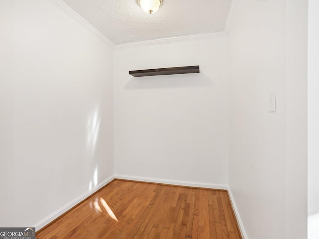 320 3rd St NE Unit 1, Atlanta, GA 30308 - spare room with crown molding, a textured ceiling, wood finished floors, and baseboards