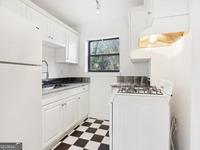 320 3rd St NE Unit 1, Atlanta, GA 30308 - kitchen featuring a sink, custom range hood, tile patterned floors, white cabinetry, and white appliances