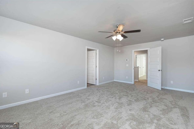 unfurnished bedroom with ceiling fan and light colored carpet