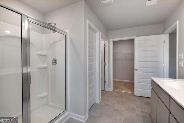 bathroom featuring vanity and walk in shower