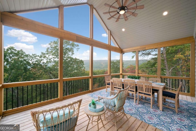 sunroom with vaulted ceiling and ceiling fan