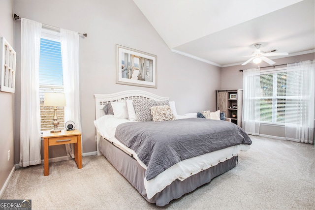 carpeted bedroom with ceiling fan and vaulted ceiling