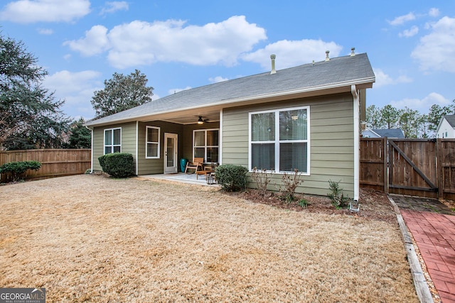 rear view of house featuring a patio and ceiling fan