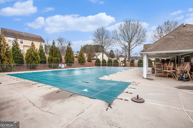 view of swimming pool featuring a patio area