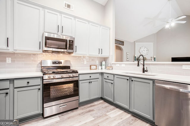 kitchen featuring gray cabinets, ceiling fan, and appliances with stainless steel finishes