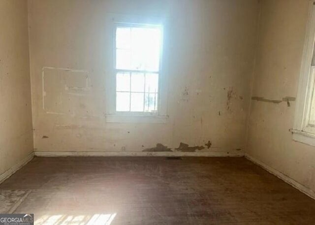 unfurnished room with a healthy amount of sunlight