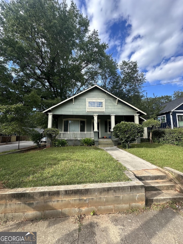 bungalow with a front yard