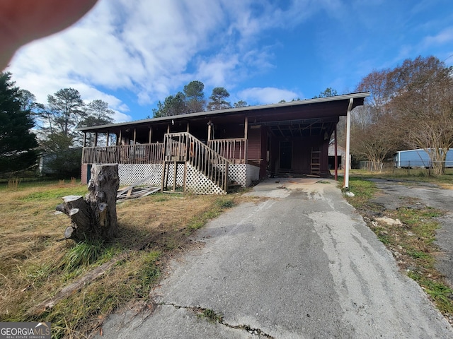 view of front facade with a carport and a porch