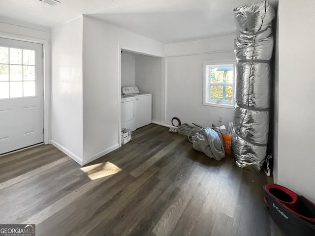 interior space featuring separate washer and dryer and dark hardwood / wood-style flooring