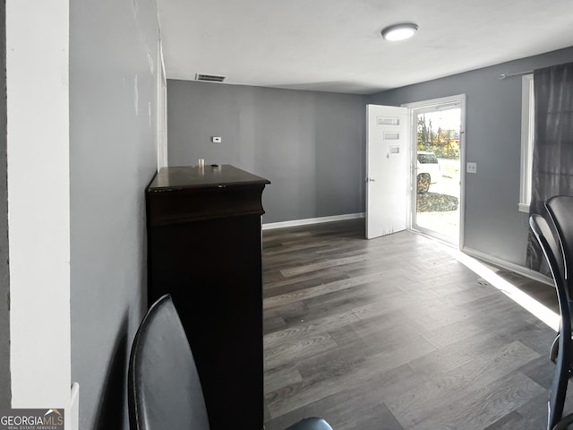 interior space with dark hardwood / wood-style flooring