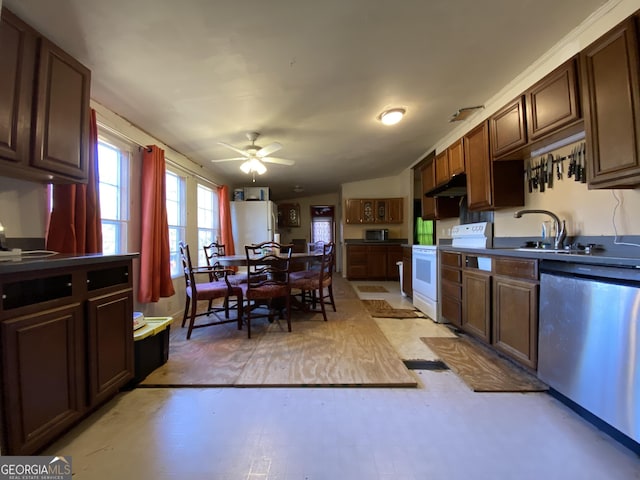 kitchen with dark brown cabinetry, white appliances, ceiling fan, and sink