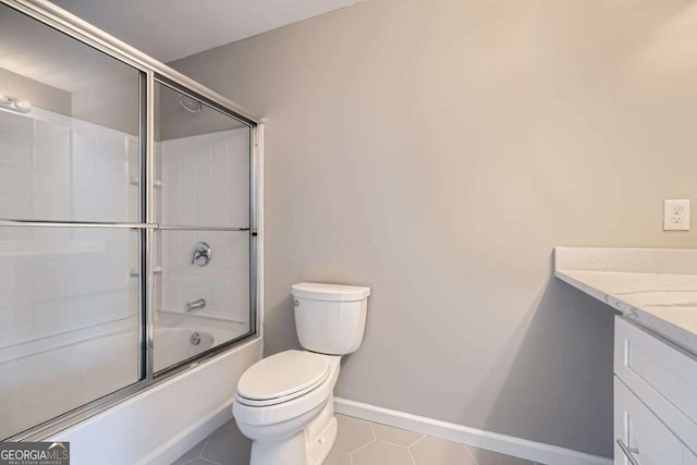 full bathroom with tile patterned flooring, vanity, toilet, and shower / bath combination with glass door